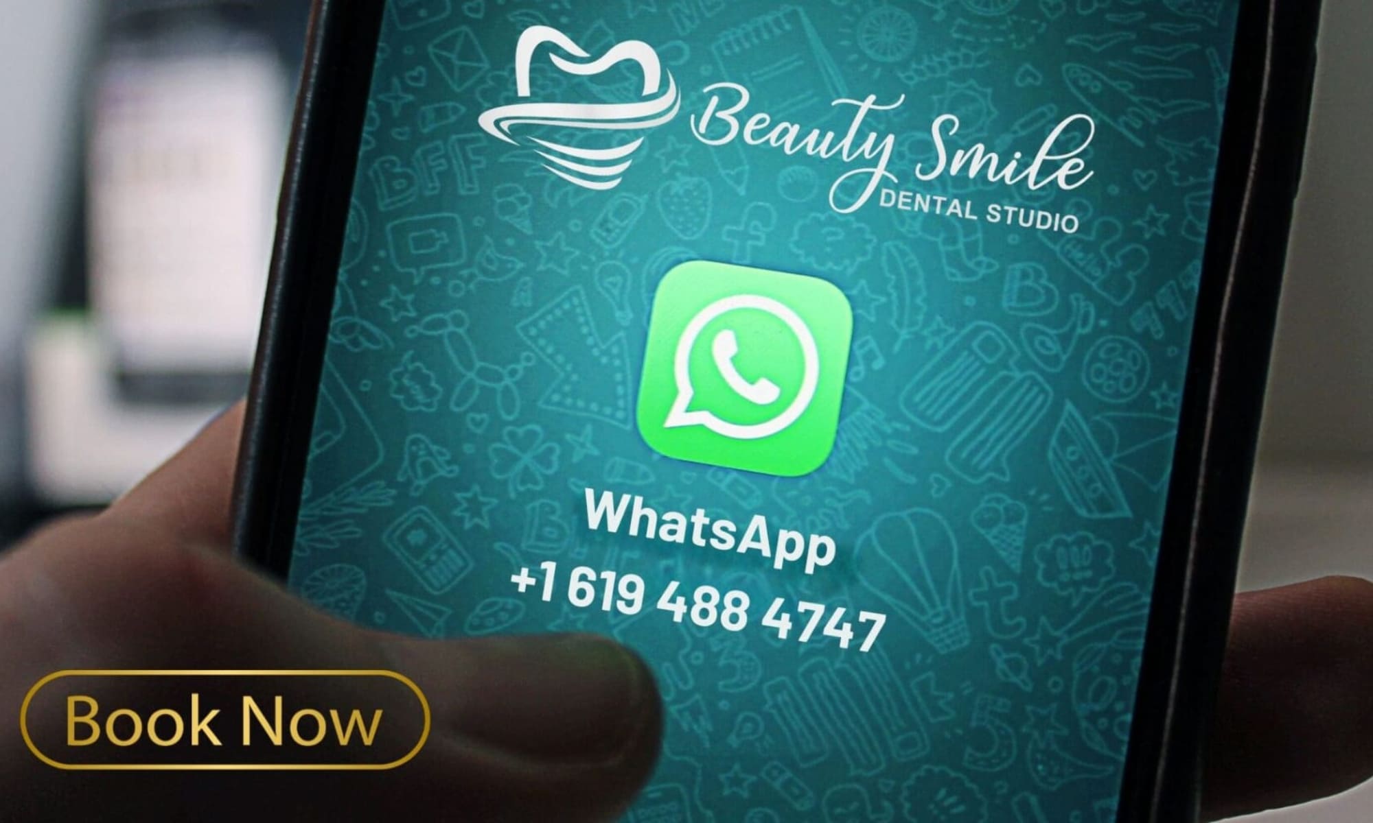 Hand holding a phone displaying Beauty Smile Dental Clinic logo and WhatsApp number for Dentist in Tijuana